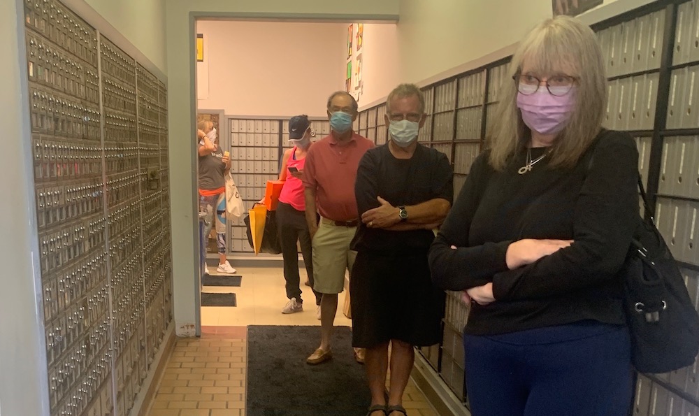 Overwhelmed by Volume, Strained Postal Workers Struggle to Keep Up